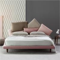 Picabia bed by Bonaldo with multicoloured cushions