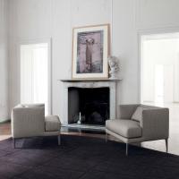 Paraiso stylish upholstered armchair with low backrest and visible feet