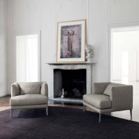 Paraiso stylish upholstered armchair with low backrest and visible feet