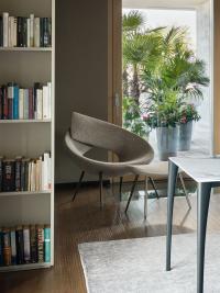 Lock upholstered armchair by Bonaldo, upholstered in fabric with a matching footrest