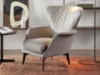 Lovy modern bergère armchair with wrap-around design and tall legs