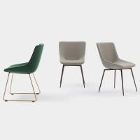 Enveloping upholstered chair also available with a sled base version