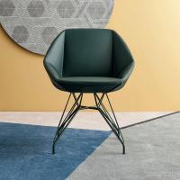 Stone is a modern swivel upholstered armchair by Bonaldo with contemporary spider pointy legs in wood or metal