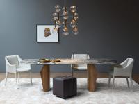 Strong scenic impact of the Flame table thanks to its textural contrast and glossy ceramic stone