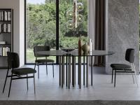 Mille table with multiple cylindrical legs in the round version by Bonaldo