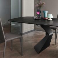 Close-up of the solid wood table top in coal brushed oak - base in gunmetal finish