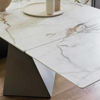 Prora table in Calacatta macchia vecchia silk finished ceramic stone - Table top and extensions blend together seamlessly 