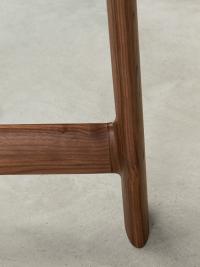 Close up of the base structure in smooth Canaletto walnut with soft edges