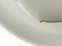 Detail of the upholstered and curved backrest