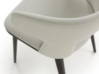 Detail of the warparound backrest that serves as armrest for the armchair