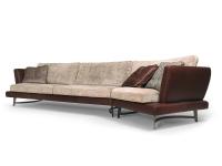 Martin sofa characterised by great formal lightness, high off the ground on shaped metal feet