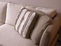 Detail of the decorative box cushions in Tamerice and Tea Rose fabric coordinated with the sofa cover