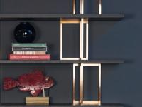 Close up of the brass supports which are arranged alternately and staggered along the shelf 