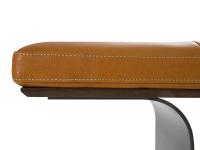 Focus on the padded, upholstered seat with an inferior wooden structure