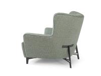 Lateral view of the Harmony armchair, characterised by a welcoming form