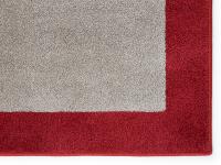 Detail of the beige and red rug