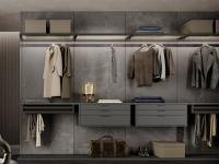 Horizon Lounge walk-in wardrobe with back in textured stone melamine, echoing the veining of natural stone