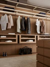 Horizon Lounge walk-in wardrobe, fabric-covered backs, drawer units with glass fronts and LED light below top shelves