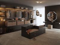 Horizon Lounge walk-in closet with shelves and hangers, further equipped with clothes hanging rods and suspended drawers