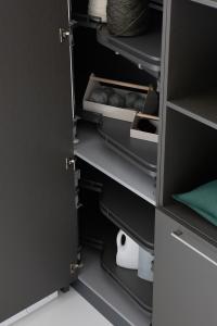 Close up of the pull-out trays in the Oasis laundry-room column cupboard