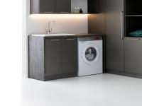Oasis laundry-room composition with washbasin base unit and open washing-machine compartment. Created with a single countertop and additional side panel.