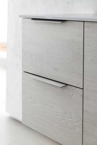 Close up of the side cabinet in 211 Igloo wood-effect melamine with cod.69 handles in a brushed nickel finish