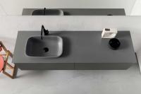 Built-in washbasin positioned in the centre of the cabinet on the left-hand side