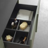 A basket with 2 organisers in the Orion Grey finish