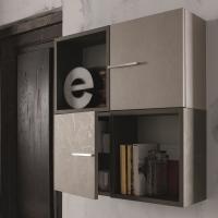 Wall units with door matching the cabinet and open elements available in several finishes