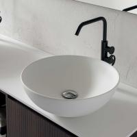 Close up of the round Roma countertop washbasin with countertop in matt white tekor resin