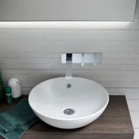 The Castillon washbasin in glossy white ceramic. The mixer hole is positioned on the wall.