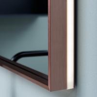 Close up of the integrated LED strip in the copper-finish metal frame