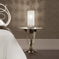 Gioia table lamp has an elegant and precious champagne silver leaf finish