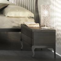 Gioia can be placed on a nightstand beside a wrought iron bed