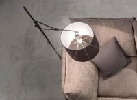 Vintage wrought-iron Lia lamp by Cantori offered beside the sofa as a reading light.