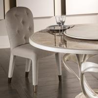 Liz is a tufted upholstered chair with classic design and modern metal feet