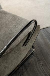 Detail of the curved metallic tube structure, black nickel finish