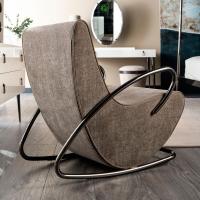 Sude view of Camilla armchair by Cantori, detail of the curvy black nickel tube structure