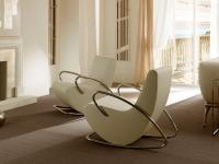 Camilla amrchair by Cantori for a refined lounge area in front of a fire place