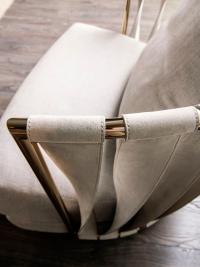Detail of the wrap-around backrest made of bent iron and twist leather bands