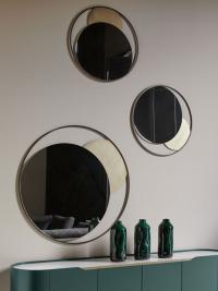 Circe mirror with round frame by Cantori, available in two wall-mounted sizes