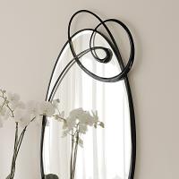 Ghirigori mirror with swirl metal frame - detail of the swirling design