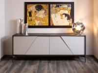 Aikido sideboard 210 cm with 4 doors: the fronts, cut at 30° and with varying thickness, create a special play of light and shadow, infusing a feeling of movement