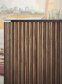 Details of the Savannah sideboard made from ash wood with a slatted finish, with a metal top