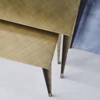 Detail set of two console tables with a brushed brass finish
