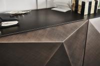 Detail of the diamond-shaped fronts in the matt brushed bronze lacquered sideboard