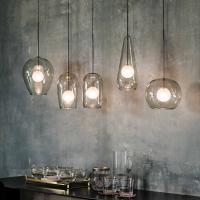 Melody is a ceiling pendant single smoked glass lamp by Cattelan. It is available in 5 shapes that are perfect to create custom compositions and that recall the shape of elegant wine glasses