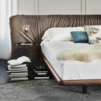 Detail on the Canaletto walnut bed frame and the fabric headboard on the Marlon bed by Cattelan