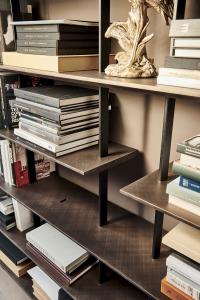 Detail of brushed bronze lacquered shelves
