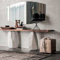 Bob tufted leather ottoman matched with the Rap Nui console table and the Stripes mirror